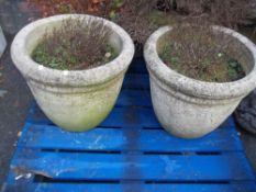 A PAIR OF RECONSTITUTED STONE LARGE GARDEN PLANTERS,br.