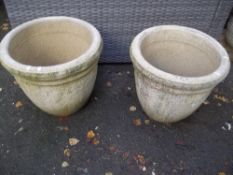 A PAIR OF RECONSTITUTED STONE LARGE GARDEN PLANTERS