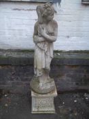 A CONCRETE LADY GARDEN STATUE ON PLINTH