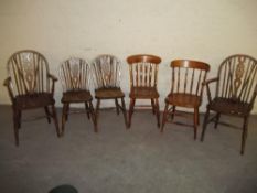 SIX SOLID WOODEN DINING CHAIRS INCLUDING 2 WHEELBACK CARVERS