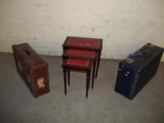 TWO VINTAGE CASES AND A REPRODUCTION LEATHER INLAID NEST OF TABLES
