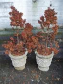 A PAIR OF CONCRETE PLANTERS