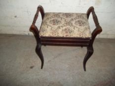 AN ANTIQUE STORAGE PIANO STOOL