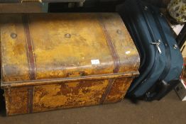 A TIN TRUNK AND A MODERN SUITCASE