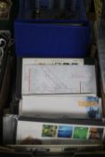 A BOX OF FIRST DAY COVERS, PRESENTATION PACKS, ROYAL MAIL POSTCARDS AND A QUANTITY OF AUTOGRAPHED TV