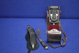 A YASHICA CAMERA TOGETHER WITH A VINTAGE KNIFE IN SHEATH
