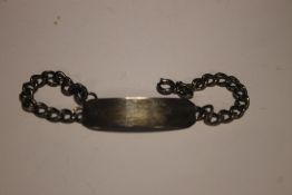 A HALLMARKED SILVER IDENTITY BRACELET