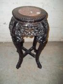 AN EBONISED MARBLE TOPPED PLANTER