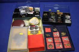 A TRAY OF MILITARY TYPE CAP BADGES