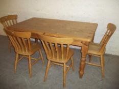 A SOLID PINE COTTAGE STYLE KITCHEN DINING SET WITH 4 CHAIRS
