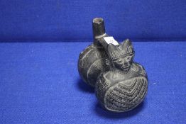 A CARVED FLASK