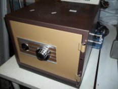 A PHOENIX COMBINATION SAFE WITH KEY AND CODE