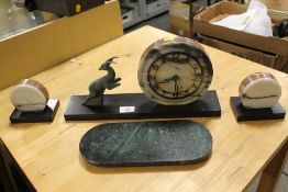 AN ART DECO SLATE AND MARBLE CLOCK GARNITURE WITH LEAPING DEER EMBELLISHMENT