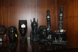 A COLLECTION OF AFRICAN CARVED WOODEN FIGURES AND BUSTS (6)