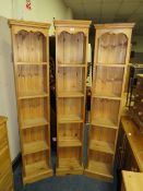 A SET OF THREE MODERN OPEN PINE BOOKCASES H-182 W-36 CM WITH ANOTHER SLIGHTLY WIDER PINS BOOKCASE (