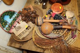 A COLLECTION OF MAINLY AFRICAN TOURIST TYPE ITEMS TO INCLUDE TRIBAL FIGURES, BASKET WEAVE TRAYS ETC
