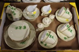A TRAY OF NORITAKE ART DECO STYLE TEAWARE WITH PALM TREE PATTERN