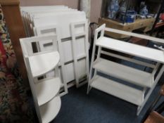 A SET OF TEN WHITE FOLDING THREE TIER BOOKCASES AND ONE CORNER BOOKCASE ( IDEAL FOR ANTIQUE FAIRS )
