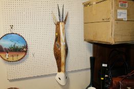 A CARVED TRIBAL STYLE ANTELOPE MASK