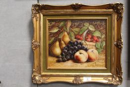 A GILT FRAMED A WILSON OIL ON BOARD STILL LIFE WITH THREE PEARS