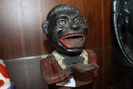 AN ANTIQUE JOLLY MONEY BANK