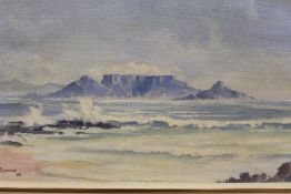 A FRAMED D ERASMUS OIL ON BOARD DEPICTING TABLE MOUNTAIN / BEACH SCENE