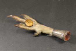 AN ANTIQUE SCOTTISH SILVER MOUNTED CLAW BROOCH