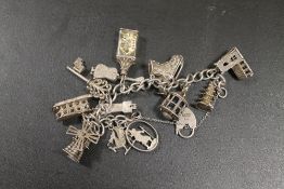 A VINTAGE SILVER CHARM BRACELET WITH LARGE CHARMS