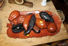 A CARVED WOODEN TRAY TOGETHER WITH A SELECTION OF CARVED WOODEN FRUIT