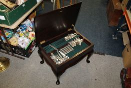 A PART CANTEEN OF CUTLERY I THE FORM OF A SMALL COFFEE TABLE