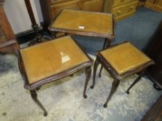 A NEST OF TABLES AND A STANDARD LAMP