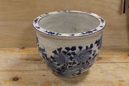 AN ORIENTAL STYLE BLUE AND WHITE GOLDFISH BOWL - CRAZED THROUGHOUT
