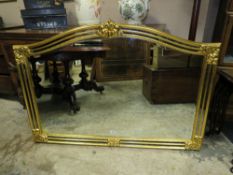 A MODERN SHAPED GILT OVERMANTEL MIRROR H-87 W-127 CM