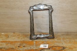 A HALLMARKED SILVER PICTURE FRAME A/F