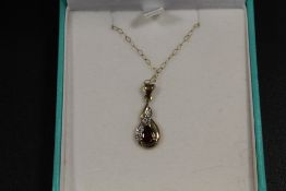 A 9CT GOLD GEMSET PENDANT AND CHAIN STAMPED 375