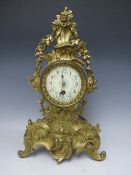 A CAST BRASS ROCOCO TIME PIECE IN THE LOUIS XV STYLE, the enamel dial with steel spade hands and