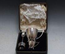 A CASED HALLMARKED SILVER MATCHED BREAKFAST SET, consisting of an Arts and Crafts style cup and
