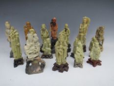 A COLLECTION OF ORIENTAL CARVED SOAPSTONE FIGURES / DEITIES, comprising fourteen individual