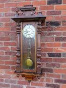 A GUSTAV BECKER CHIME STRIKE VIENNA WALL CLOCK, the case with mahogany fronted veneers, turned