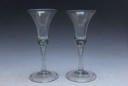 A PAIR OF ANTIQUE WINE GLASSES, both with bubble in stem, H 18.5 cm