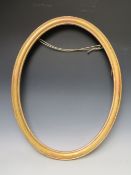 A 19TH CENTURY OVAL GOLD FRAME, frame W 4 cm, rebate 62 x 47 cm
