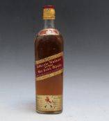 A VINTAGE BOTTLE OF JOHNNIE WALKER RED LABEL WHISKY - TOP SHOULDER