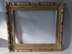 AN EARLY 20TH CENTURY GOLD AND BLUE DECORATIVE FRAME, with slip, frame W 6 cm, frame rebate 65 x