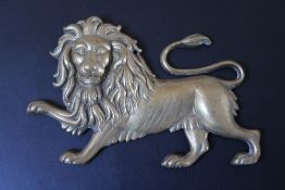 A BRONZE PLAQUE OF A LION RAMPANT, W 23.5 cm