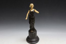 A FIGURE OF A LADY ON A MARBLE BASE, H 42.5 cm