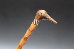 A NOVELTY WALKING STICK WITH CARVED BIRD HEAD POMMEL, L 84 cm
