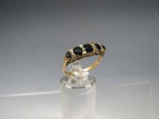 A HALLMARKED 9CT GOLD FIVE STONE SAPPHIRE HALF ETERNITY STYLE DRESS RING, ring size Q ½,