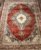 A 20TH CENTURY EASTERN RUG WITH FLORAL CENTRAL CARTOUCHE 231 X 156 CM