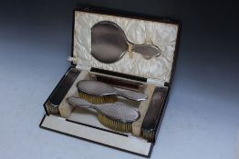 A CASED HALLMARKED SILVER SIX PIECE DRESSING TABLE SET RETAILED BY KEMP & WILCOX GOLDSMITHS OF