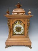 A LARGE JUNGHANS WESTMINSTER CHIME MANTLE CLOCK, the architectural case having mahogany veneers,